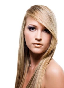 Close-up portrait of an Young attractive woman with beauty straight long blond hair