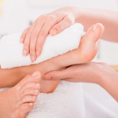  Close-up of relaxation pedicure process in spa salon.